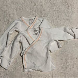 Set of two cuffed sleeve button tops